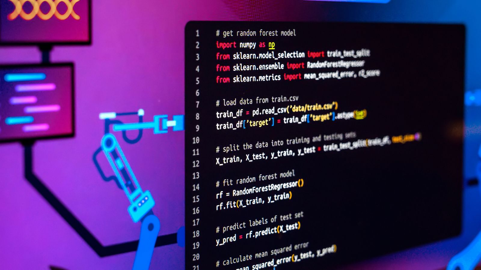 A monitor showing Python code for training a machine-learning model, lit in blue and magenta