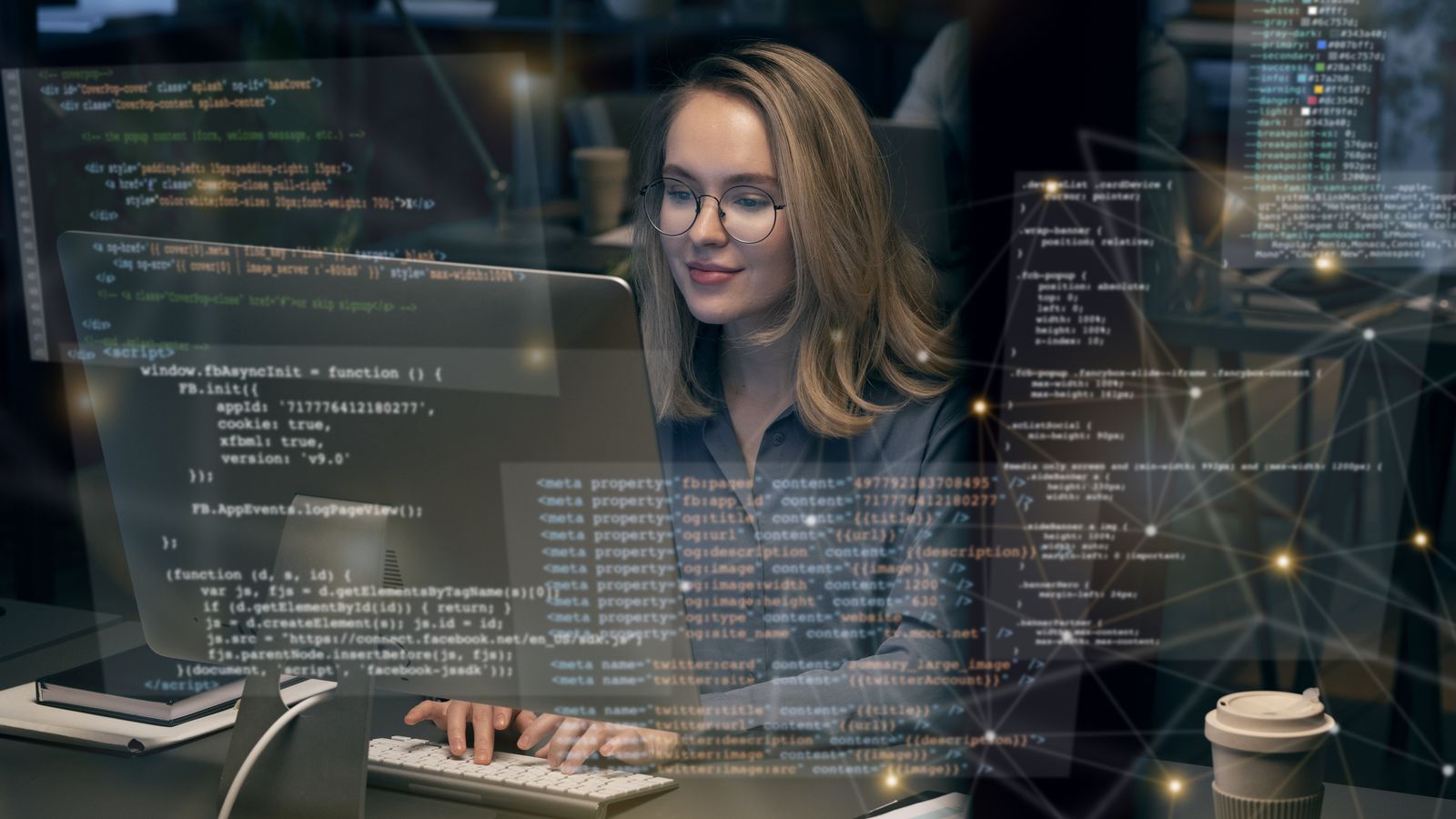 A developer at a desktop computer, with HTML and meta-tag markup overlaid across the screen